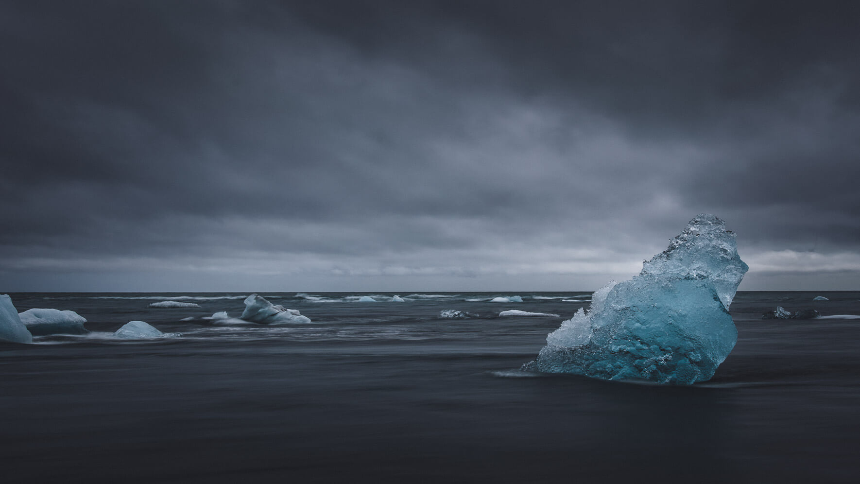 Washed up iceberg on the black sand beach of Jökulsárlón Glacier Lagoon, Iceland