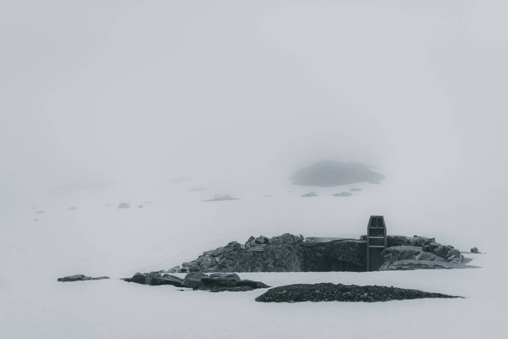 Industrial architecture and snow landscape near lake Styggevatnet in Norway