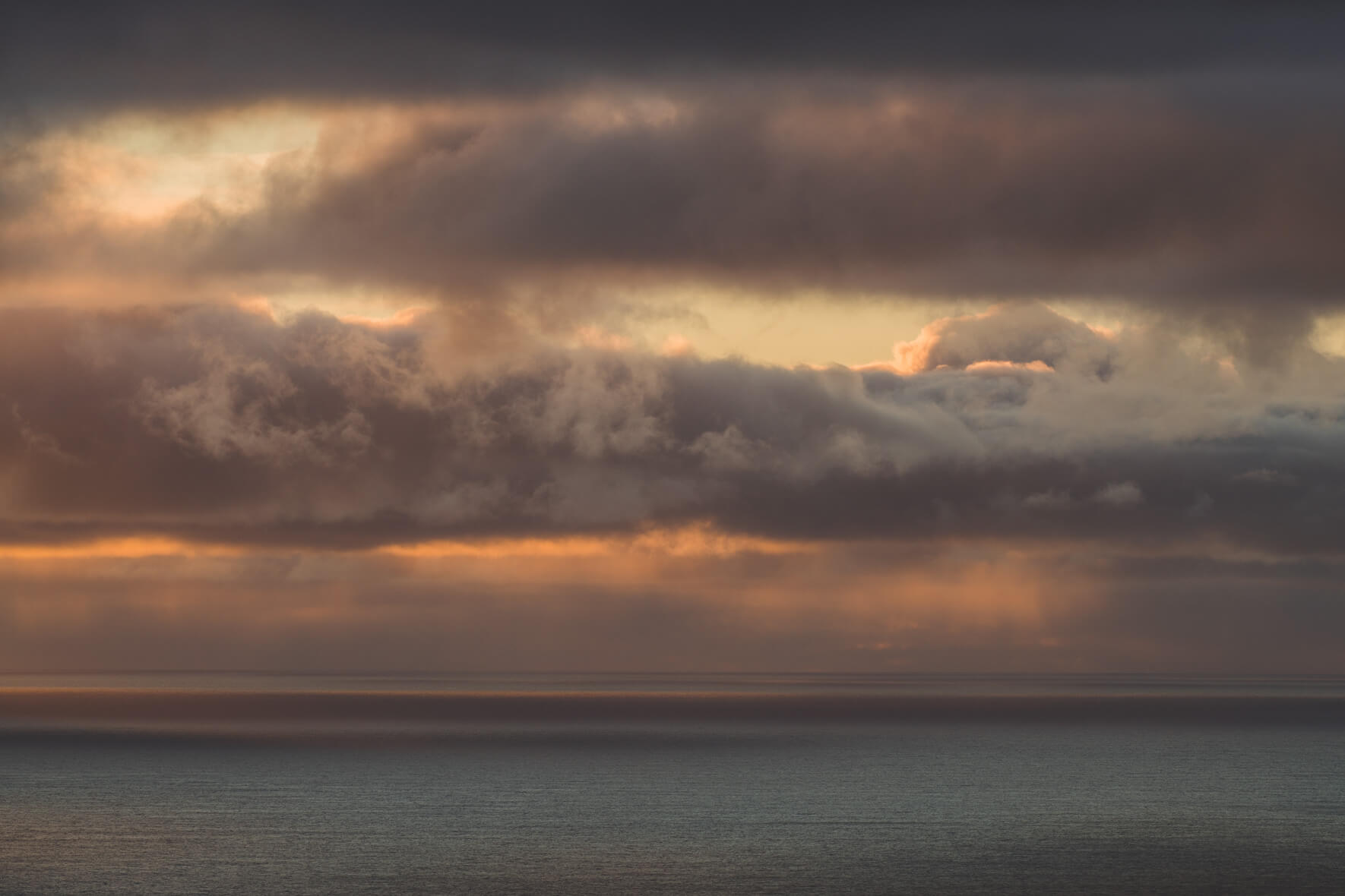 Dramatic Sunset over the Ocean with Clouds